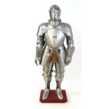 Militaria: a 20thC medieval style display/novelty suit of armour, constructed from articulated steel
