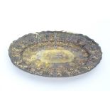 A Victorian silver oval dish with floral, fruit and scroll decoration, hallmarked London 1888, maker