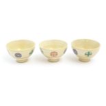 Three Japanese tea bowls with roundel detail. Marked Arita Japan under. Approx. 2 1/4" high (3)