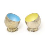 A pair of German silver salts with enamel interiors. Marked .835, maker Hermann Bauer. Approx. 1 1/