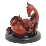 A Royal Doulton flambe model of horses on a circular base, The Gift of Life, Mare and Foal. Marked