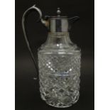 A glass claret jug of ovoid form with silver plate mounts and handle. Approx. 11 1/2" high Please