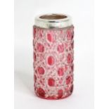 A cut cranberry glass pot with white metal mount. Approx. 2 3/4" high Please Note - we do not make