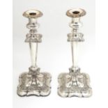 A pair of silver plate candlesticks with acanthus scroll and floral decoration Approx 12" high