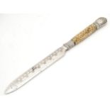 A bread knife with antler handle and silver collar. Approx12 1/4" long Please Note - we do not