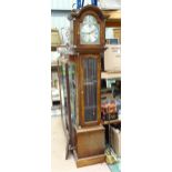 A modern long case clock with brass dial. Approx 78" high overall Please Note - we do not make