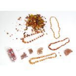 A quantity of assorted necklaces and loose beads, to include some carnelian hardstone examples