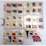 A large quantity of B.D.V. and Kensitas silk etc. cigarette cards depicting flags. Please Note -