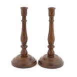 A pair of 20thC turned oak candlesticks. Approx. 11" high (2) Please Note - we do not make reference