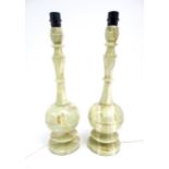 A pair of vintage onyx table lamps. Approx 21 1/2" high Please Note - we do not make reference to