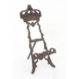 A 20thC cast table top easel with floral, foliate and crown detail. Approx. 13 1/4" high Please Note