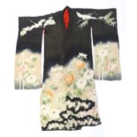 Vintage fashion / clothing: A black, patterned Japanese silk Kimono with red lining, chest