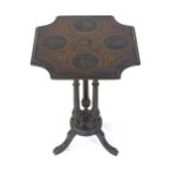 A 19thC occasional table in the Neo-classical style, having a shaped top depicting fighters and