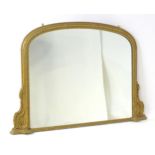 A 19thC giltwood and gesso over mantle mirror, having a beaded surround and classical mouldings to