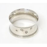 A silver napkin ring hallmarked London 1971, maker William Comyns & Sons Ltd. Please Note - we do