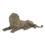 A 20thC cast brass model of a recumbent lion. Approx. 12 1/4" long Please Note - we do not make