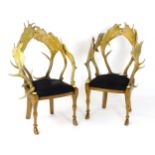 A pair of Anthony Redmile antler chairs, having tub style backrests formed from fallow deer horns.