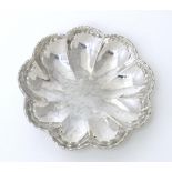 A Continental .800 silver dish of lobed form with hammered decoration. Approx. 3 1/2" wide Please