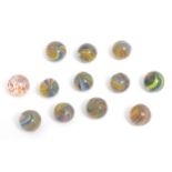 Toys: A quantity of assorted glass marbles, many with colours twists. Approx. 1/2" diameter Please