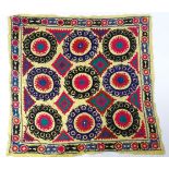 Carpet / Rug : An Uzbek Suzani embroidery, the cream ground decorated with embroidered roundel and