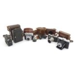 A quantity of 20thC cased cameras to include a Zeiss Ikon Nettar 517/16 camera, a Corfield