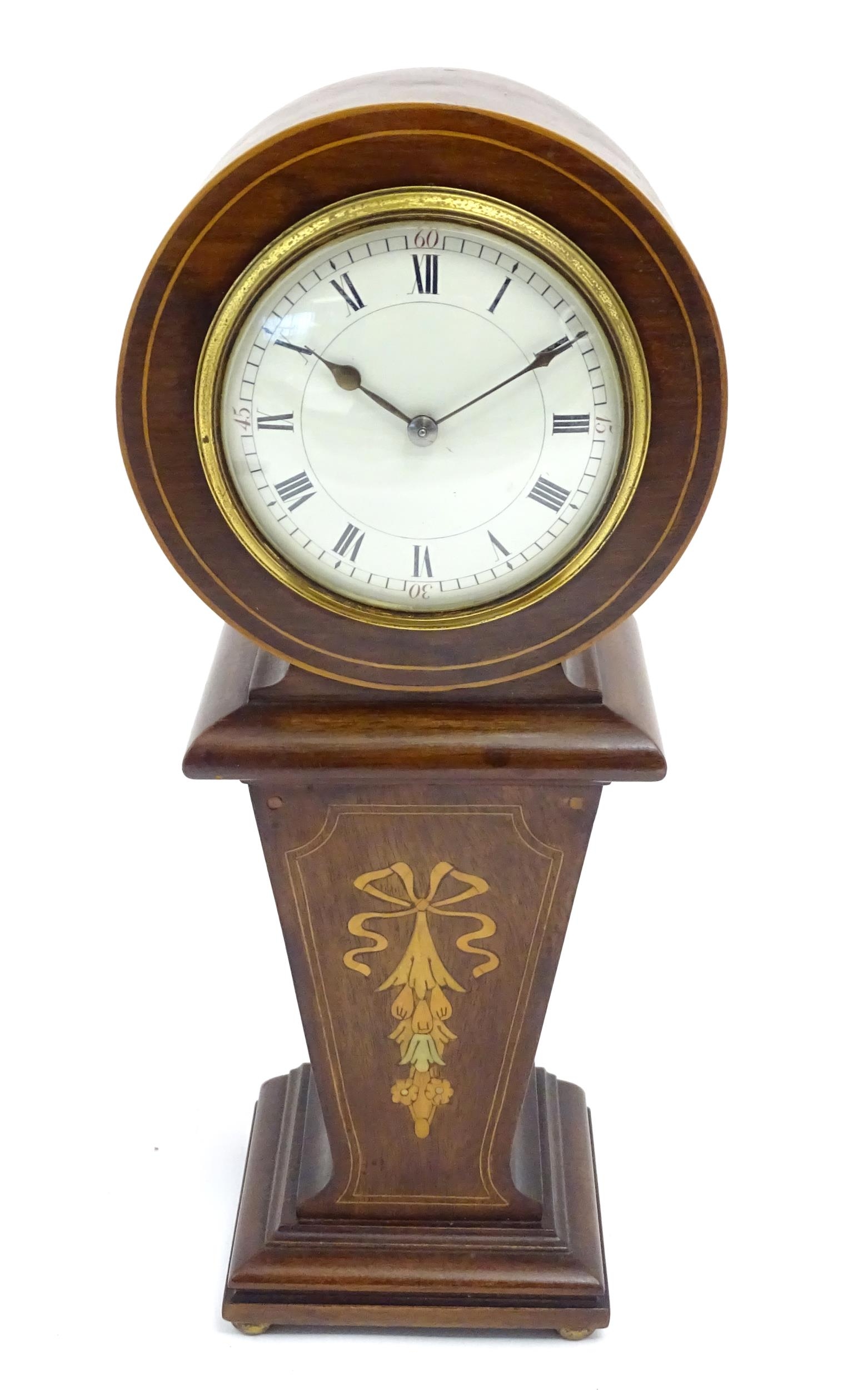 A mahogany mantle clock with inlaid detail and white enamel dial with movement by Duverdrey &