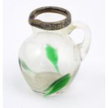 An Art nouveau small glass jug with green detail and silver rim hallmarked Birmingham 1900 maker