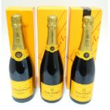 Champagne : Three 750ml bottles of Veuve Clicquot champagne in gift boxes, comprising two Brut and a
