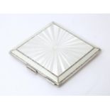 An Art Deco silver compact with guilloche enamel decoration hallmarked Birmingham 1949, maker