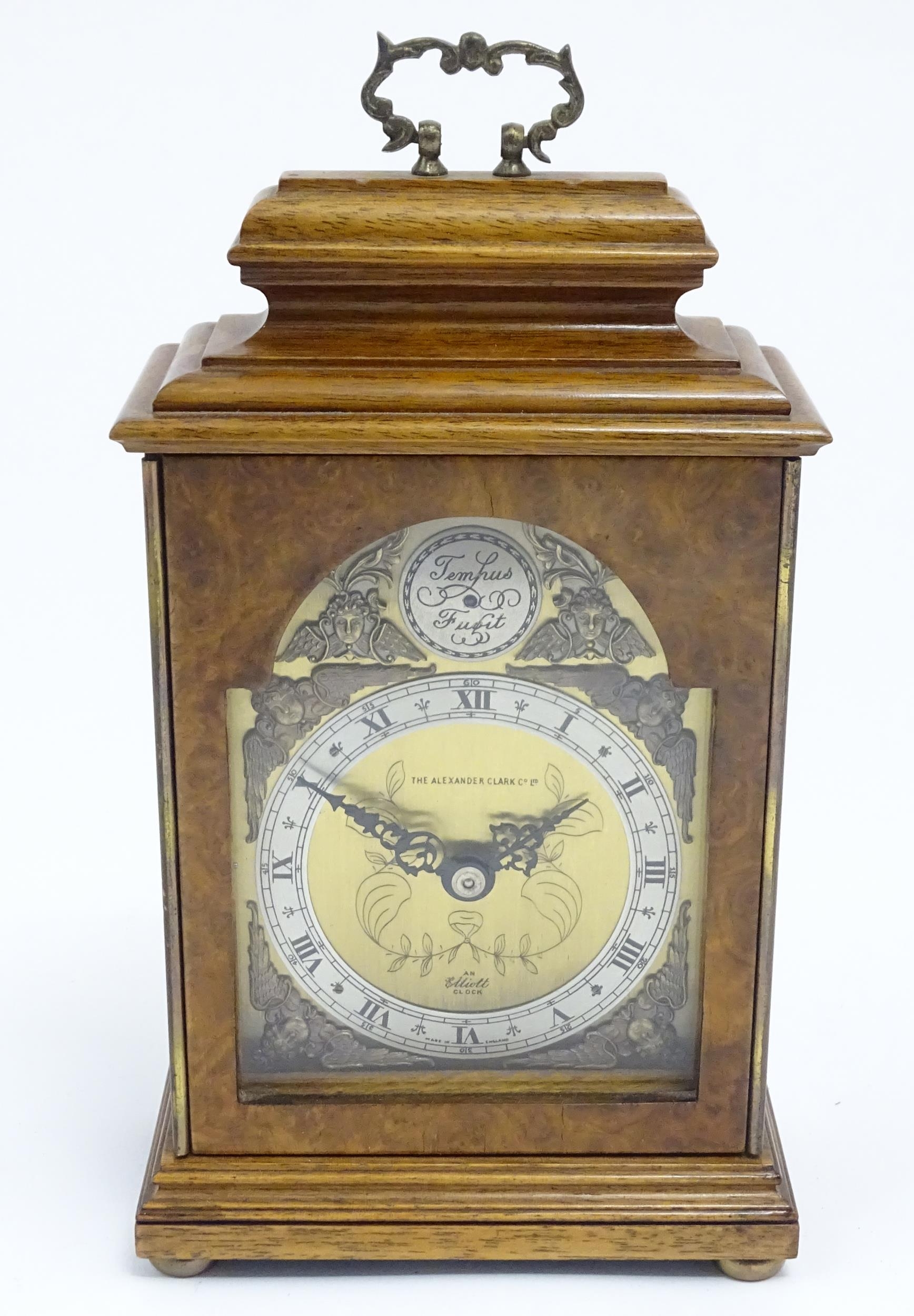 A 20thC walnut and burr walnut 'Elliot clock', the brass dial signed Alexander Clark Co Ltd and with