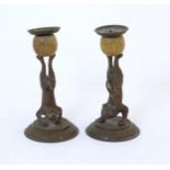 Two 20thC novelty cast candlesticks by Arthur Court, the column of one modelled as an acrobatic