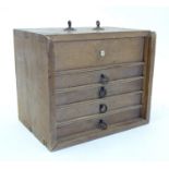 Toys: A wooden box with five drawers containing 144 20thC bamboo Mahjong gaming counters. Box