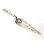 A silver bookmark / paper clip of trowel form with engraved decoration to handle, hallmarked