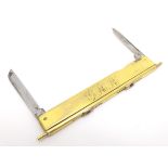 An unusual yellow metal folding combination knife / propelling pencil, one side set with two blades,