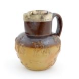 A Doulton two tone stoneware jug with a silver rim hallmarked silver rim, London 1872, the body with