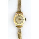 A ladies Precimax 17 Jewels antimagnetic wristwatch with a 9ct gold strap. Case approx 3/4" wide.