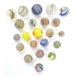 Toys: A quantity of German vintage glass marbles with coloured twists. Largest approx. 1 9/16" (