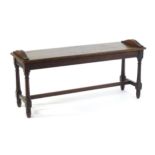 A late 19hC walnut window seat with a rectangular seat surmounted by arched reeded mouldings, the
