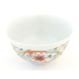 A small Chinese famille rose bowl decorated with scrolling floral and foliate detail, and bat detail