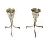 A pair of Mexican .925 silver candlesticks standing on three feet. Approx. 4" high (2) Please Note -