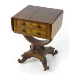 An early 19thC rosewood drop flap table, having two short drawers with turned wooden handles above a