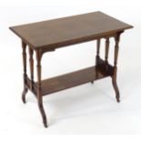 A late 19thC / early 20thC walnut occasional table with a rectangular top above shaped supports