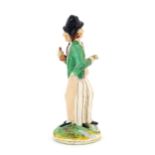 A Victorian Staffordshire pottery double-sided figure of a man standing on a circular base, one side