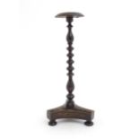 A Georgian simulated rosewood turned wig stand on a tripod base with three squat bun feet. Approx.
