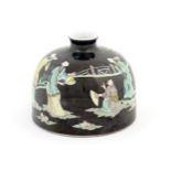 A Chinese famille noir brush wash pot of domed form decorated with figures in a garden landscape.