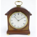 A Comitti battery powered mantel clock. Approx 8 1/2" high Please Note - we do not make reference to