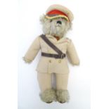 Toy: A limited edition Merrythought mohair teddy bear with stitched nose, mouth and claws, wearing