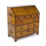 A late 18thC mahogany ships / cottage bureau, having a fall front above four long drawers with