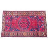 Carpet / rug : A Hamadan rug, with blue and fuchsia ground decorated with stylised floral motif with