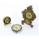 Three various clocks comprising an octagonal cased alarm clock , the dial signed Goldsmiths &